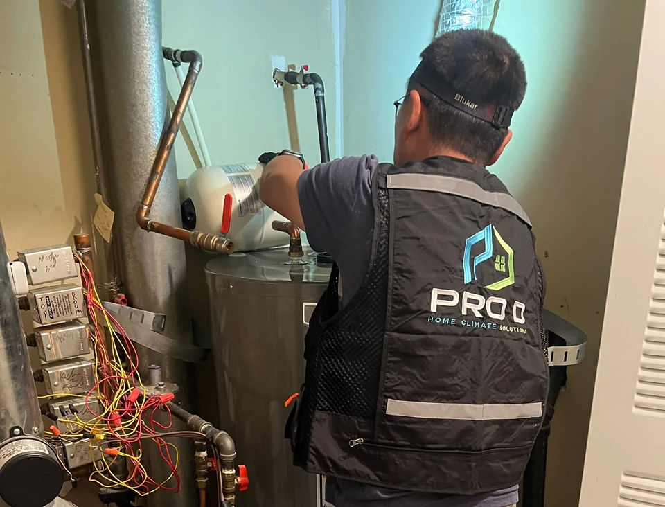 A ProD technician working on the Langley water heater project
