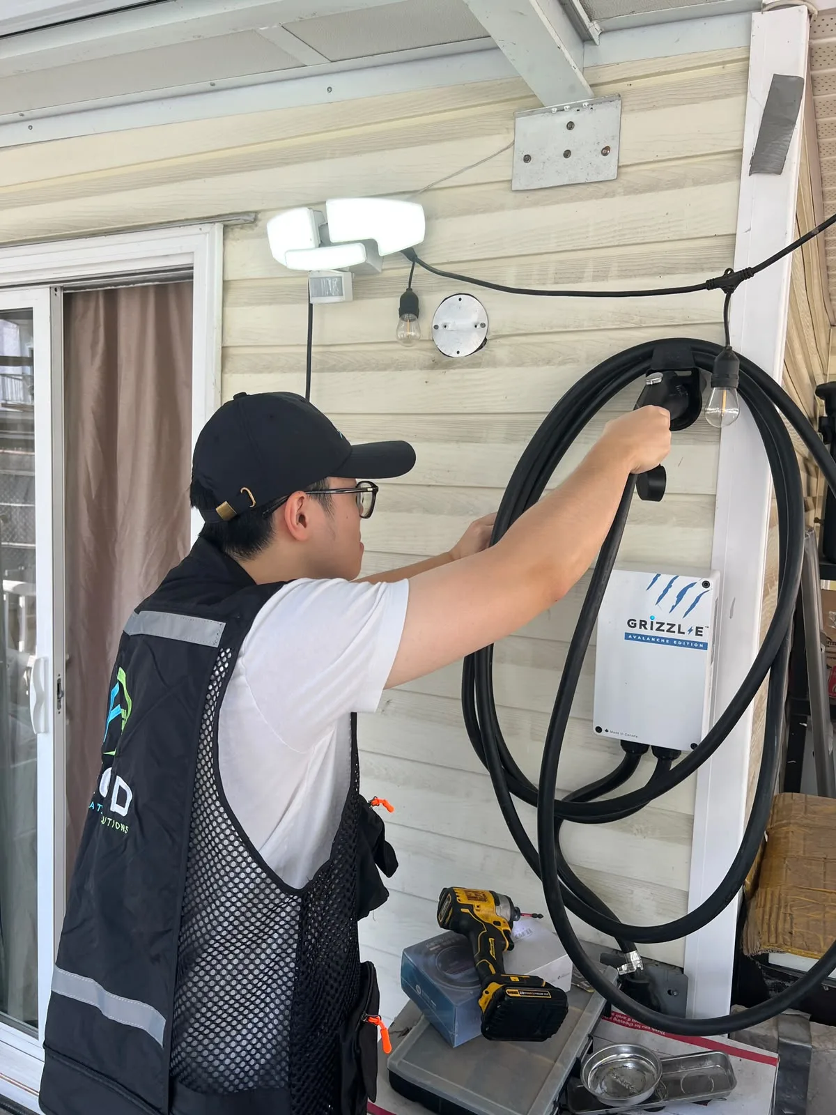 Technician working on a Grizzl-E home charger