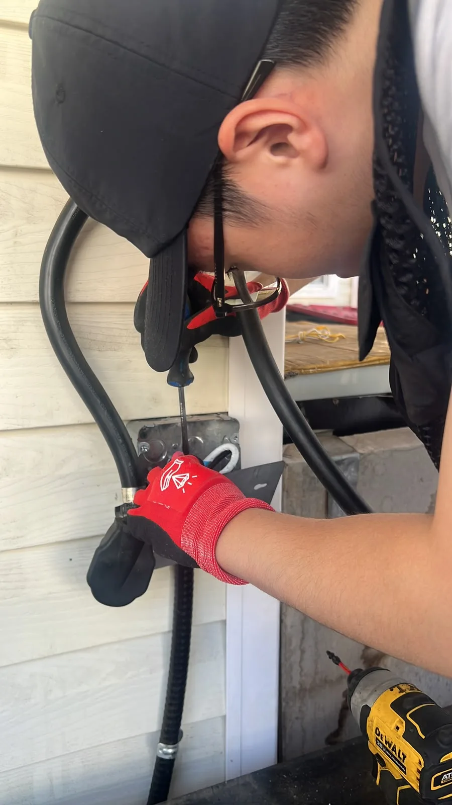 Technician working on EV charger wiring