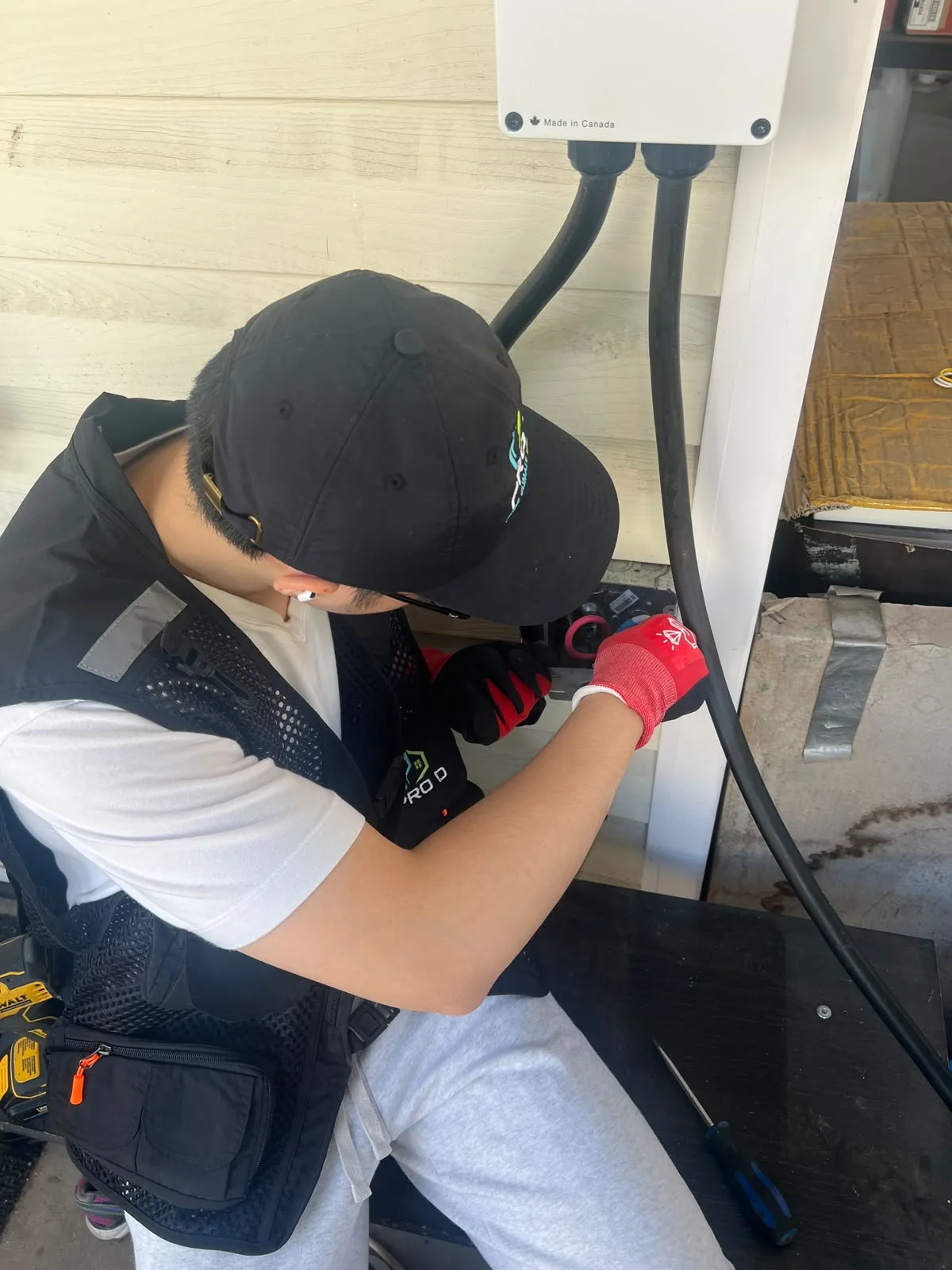 Technician working at the charger connection