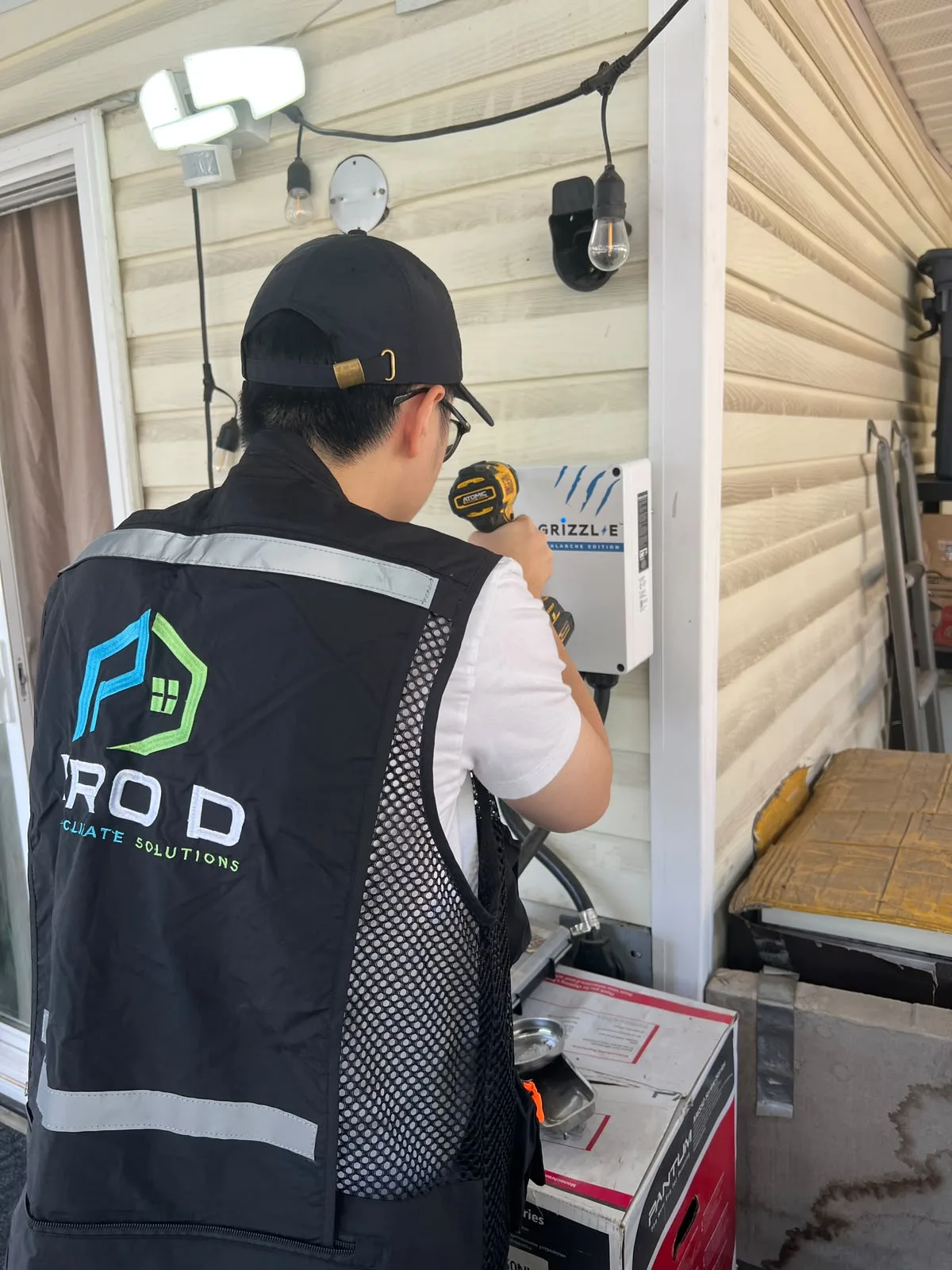 Technician working beside the Grizzl-E charger