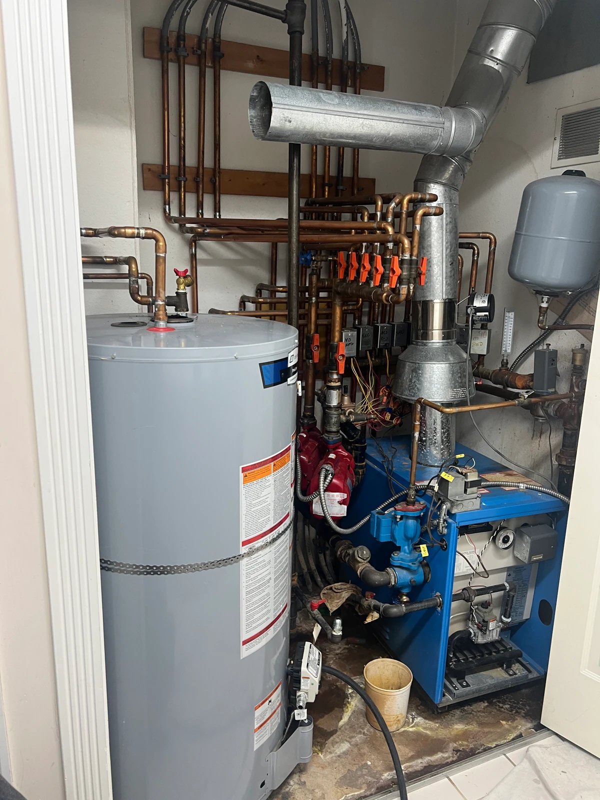 Separate boiler and storage tank shown in the Richmond heating and hot-water project source photo