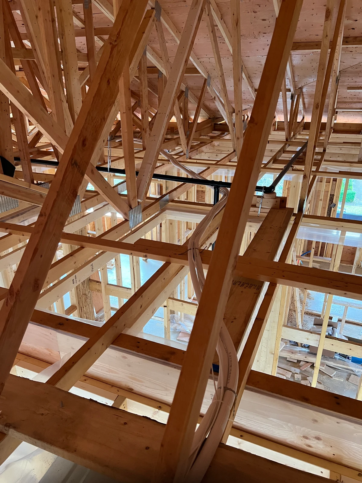 Open timber framing in the Vancouver Daikin HVAC and HRV rough-in project