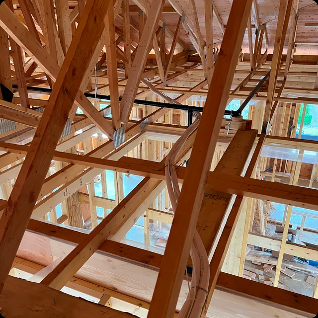 Open timber framing in the Vancouver Daikin HVAC and HRV rough-in project